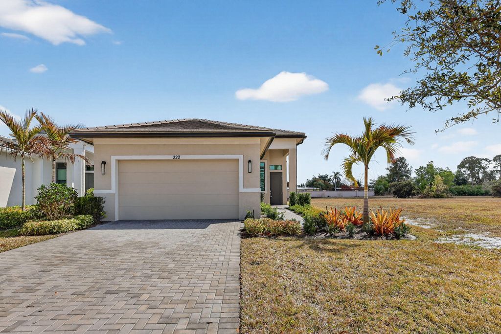 Photo of 320 SE Via Sangro, Port Saint Lucie, FL 34952 (MLS # R11163718)