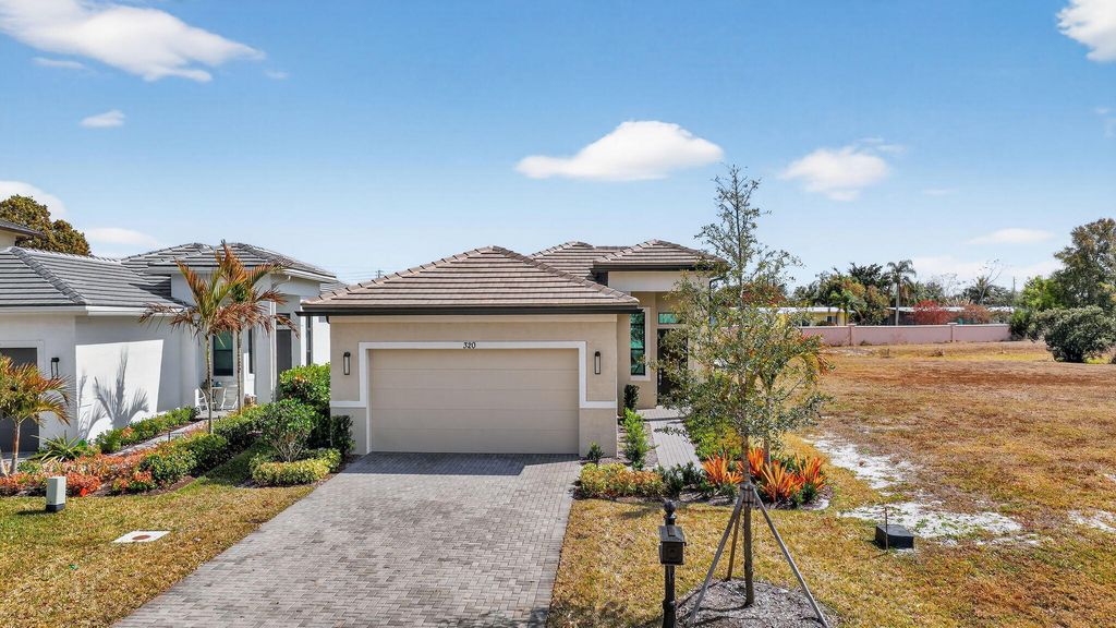 Photo of 320 SE Via Sangro, Port Saint Lucie, FL 34952 (MLS # R11163718)
