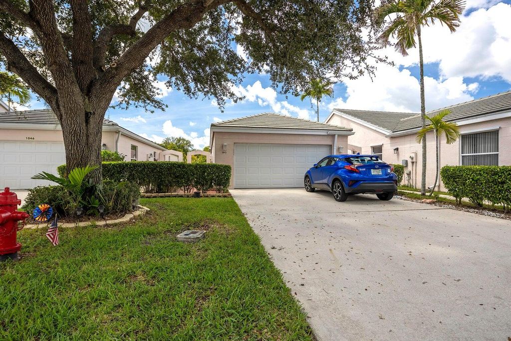 Photo of 1045 Island Manor Drive, Greenacres, FL 33413 (MLS # R10998109)