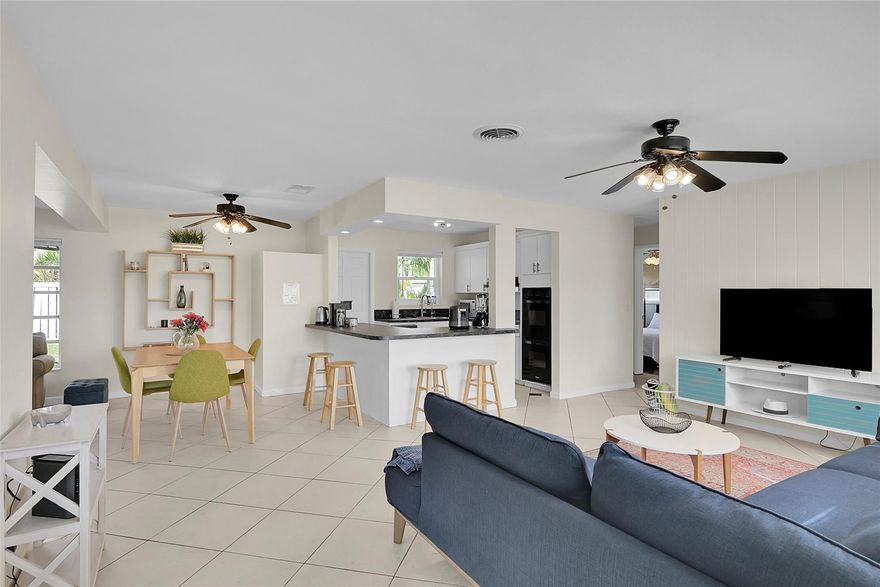 Welcome to The Cove, one of Deerfield Beach's most desirable neighborhoods! This bright and charming 2-bed/1-bath home is filled with natural light and features new tile flooring, stylish barn doors, a well-maintained kitchen, and a beautiful private fenced backyard, perfect for entertaining. A newly added bathroom window brings in fresh air and light. Plus an easy conversion opportunity to make it a 2/2 and add instant value. All of this just steps from the newly renovated Deerfield Beach Pier, waterfront dining, shopping, and supermarkets. A true slice of the Florida lifestyle. Sold as-is. All measurements are approximate; buyer to verify.