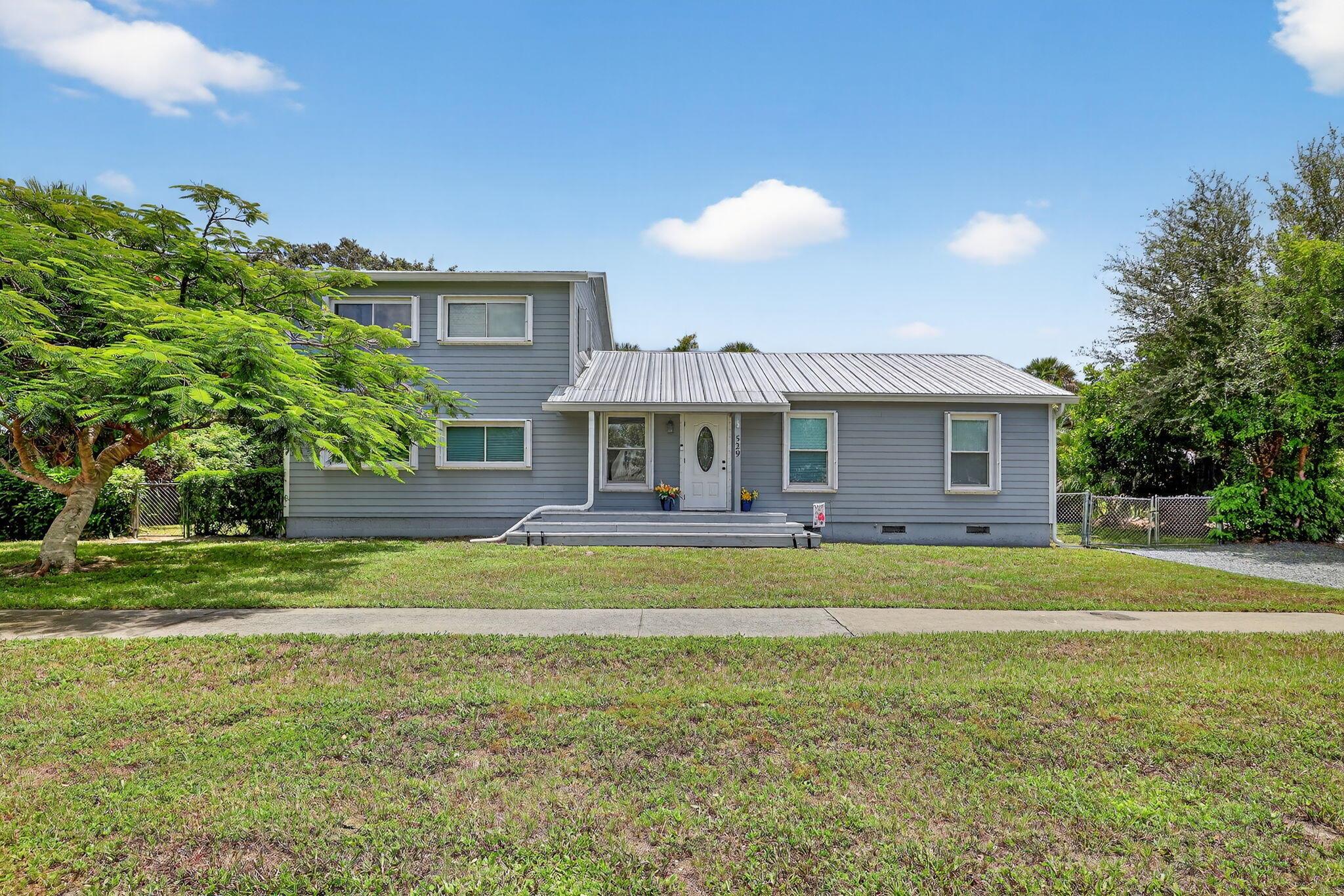 Do you want a charming and updated home close to the water AND downtown STUART? THIS IS YOUR HOME! This has everything you could ask for! Updated roof, newer AC, accordion shutters, new sprinkler pump, updated deck and the shed/garage has water & power! Talk about curb appeal!?!? As you approach the home, you feel the inviting, beauty of being close to the water, it's a VIBE! Stepping in you will find wood laminate flooring and a quaint formal living/entry space. As you tour through you can step down to the family room or walk straight to the heart of the home, your updated kitchen! Upstairs features a suite with updated bath and HUGE closet! There is one original half bath to the home that gives so much character and charm! HUGE yard perfect for all of your water vessels and even an RV.