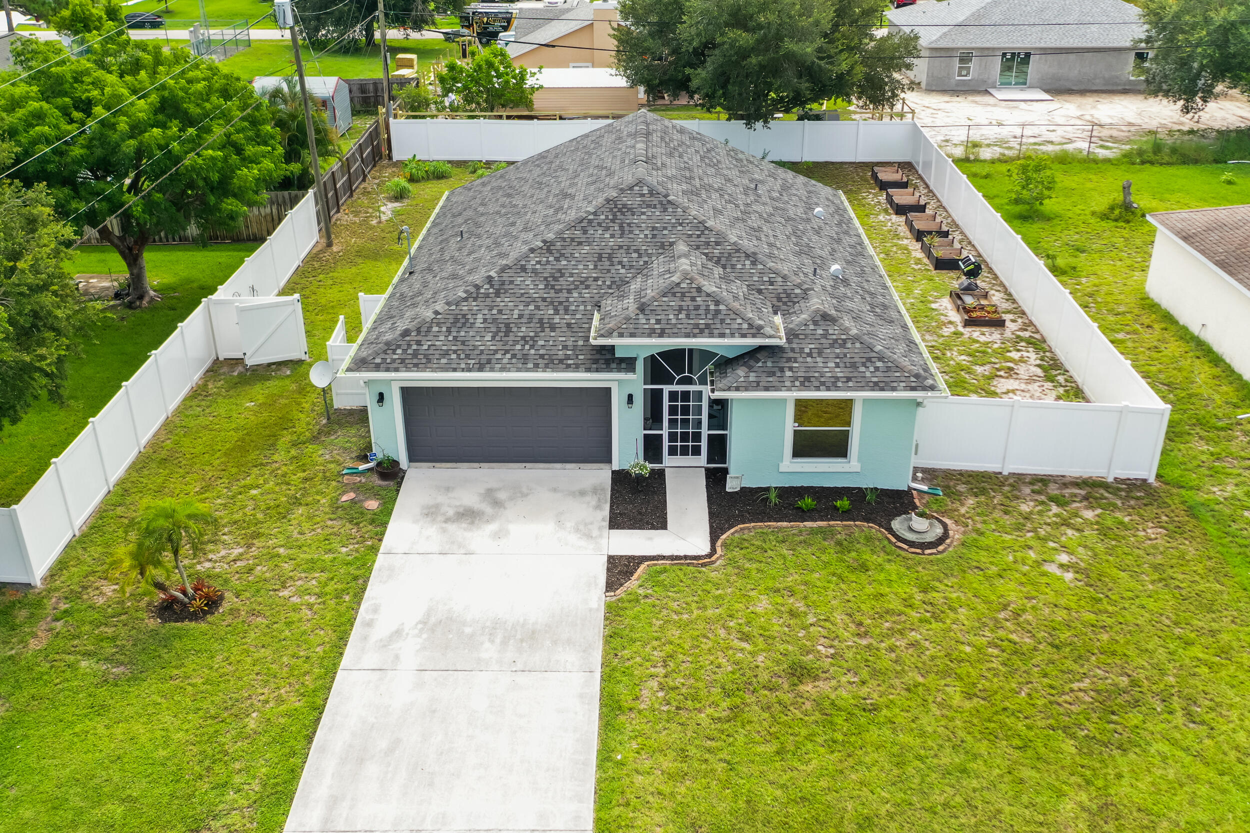 Welcome to 3509 SW Vincennes Street, a meticulously maintained CBS home built in 2003 and nestled on a spacious 0.23-acre lot in the heart of Port St. Lucie. This 3-bedroom, 2-bath home offers vaulted ceilings in the main living area and primary bedroom, creating a bright and open feel. Enjoy peace of mind with a 2021 roof, 2023 gutters and fencing, and complete hurricane shutters. The fully fenced backyard features fruit trees and plenty of room to relax or entertain. Additional highlights include a 2021 water heater, freshly painted exterior (2023), and a screened front porch. Ideally located close to shopping, dining, and I-95, this property blends comfort, convenience, and lasting quality--perfect for those seeking a move-in-ready home with thoughtful upgrades inside and out.