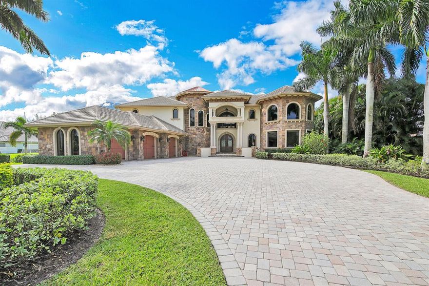 Make sure to watch the video! Custom built by a builder on 1.3 acres with so many amenities you won't want to leave home! Exterior features insulated concrete form construction, impact windows, decorative stone, copper cupola, extensive paved driveway, lush landscaping, and 3-car garage with carriage house doors. This 9455 sq ft home includes 5 bdrms, 3 full baths, and 2 half baths, separate mother-in-law suite, full cabana bath, gym, sauna, man-cave, and theatre. Inside marvel at 27' ceilings, polished marble & honed travertine flooring, 8.5'' baseboards, decorative crown molding, and spectacular architectural details throughout. Outdoors find a kitchen, decorative waterfalls, oversized saltwater pool, smaller pool separated by a rock waterfall, & a water view offering stunning sunsets This home includes a fully equipped chef's kitchen featuring custom wood cabinets and granite counter tops, a spectacular stone arch housing a KitchenAid gas stove, double oven, oversized refrigerator, warming draw, 2 dishwashers, and massive walk-in pantry. Adjacent to the kitchen you will find a spacious dining room with decorative ceiling and beautiful architectural pillars that separate the room from the formal living room. Off the kitchen is a large family room with custom wood wall unit and French doors that open to a spacious office with glass doors that lead to the outdoor space. The enormous master suite provides stunning pool and water views from a custom seating area, fireplace, breakfast bar and huge walk-in closet with dressing island. Relax and unwind in the circular Aquatic spa tub featuring air and jet massage, separate programmable multi head shower, marble floors, sauna, and TV built into the mirrored vanity area. This property also includes an expansive 2nd floor mancave with dedicated spiral staircase featuring a large wet bar with refrigeration, nugget ice machine, pool table, TV and custom wall unit, a spacious gym with professional rubber flooring, TV and views out to lush landscaping, a 2nd floor home theatre with sound walls, JBS Syntheses surround system, Runco Rear Projector with THX and a massive screen. Via a separate entrance find a spacious mother-in-law suite with a full kitchen, Jacuzzi spa tub, bedroom, walk-in closet, and washer and dryer. Other features include high energy impact windows, multi zone AC, propane gas generator. Sherbrooke Estates located in west Lake Worth is zoned for A-rated schools and within minutes to the Florida Turnpike is truly a hidden gem of an exclusive community featuring custom built estate homes ranging in size from approximately 3,000 sq ft to nearly 10,000 sq ft all positioned on oversized, private lots between 1 and 3 acres. The community offers sizeable lakes stocked with fish and allowing electric boats, wild-life throughout, and close to Wellington night life and shopping. The community also offers tennis and pick-ball, and a clubhouse for family and neighborhood events. Don't miss this opportunity to own this one-of-a-kind home!!.
