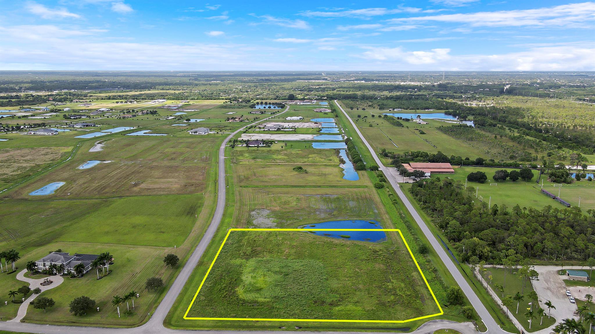 Located in a secure Equestrian Community with 5.12 acre lot surrounded with million dollar homes A rated schools community of Meadow Run. It is a corner lot with paved road. many possibilities to build your dream home. conveniently located near I-95 and the Florida Turnpike.