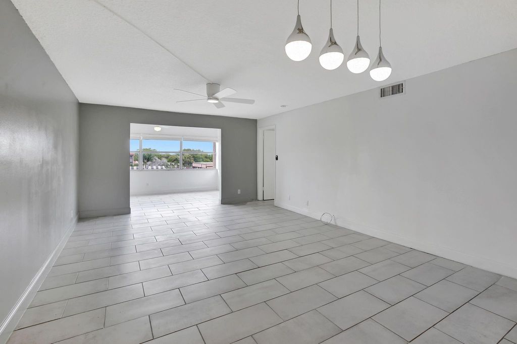 Photo of 9861 Sunrise Lakes Blvd #303, Sunrise, FL 33322 (MLS # F10534036)