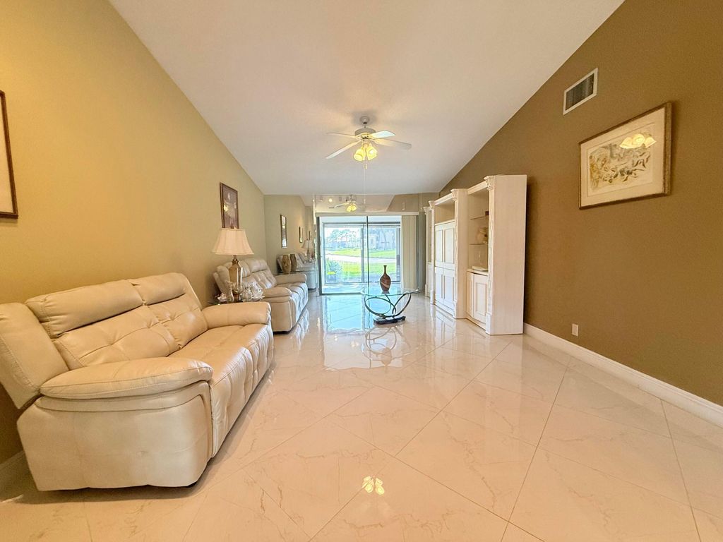 Photo of 809 Sky Pine Way #F, Greenacres, FL 33415 (MLS # B26006034)