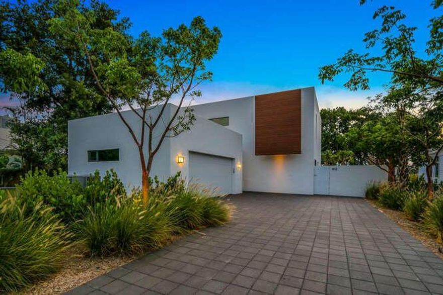 Dreams of modernist sophistication and chic comfort in South Florida living no longer need to be mutually exclusive. Designed by visionary architect Jeff Silberstein, 902 Hibiscus Lane is a contemporary and rare waterfront jewel for sale in Delray Beach's alluring Lake Ida community.

Unique in its modern design yet basking in a soothing simplicity and clean lines, this lakefront home is located on a secluded cul-de-sac in a prime location directly on Lake Ida. Boasting abundant outdoor living space to take advantage of the immaculate year-round South Florida weather, 902 Hibiscus is one of the few residences in its neighborhood to enjoy waterfront views. Walls of glass flank the entryway and cavernous family room, invoking an intimate connection with nature while enjoying the home's laid-back interior.

Its ultra-modern kitchen features sleek cabinetry and state-of-the-art appliances, and overlooks the family room while still providing immaculate lake views. Upstairs living spaces include a master suite with a walk-in closet, a spacious and contemporary wet room with his-and-hers sinks and shower heads, and a corner office with windows overlooking the lake.

With five bedrooms and 4.1 bathrooms, 902 Hibiscus is 4,844 total SF with 3,606 SF under air. The striking duality of the home's design is highlighted by touches like the eye-catching glossed concrete flooring on the ground level, which is complimented by cozy wood flooring on the second floor. Additional amenities include a laundry room with a secondary fridge, a two-car garage, and solar heating for the pool.

The residence's vast and secluded outdoor spaces includes a cantilever-shaded backyard patio area with air circulators, a summer kitchen set in concrete, a sizable backyard fit for ample recreation, a stylish in-ground pool, and a separate side yard with a fire pit. Best of all, the home and its outdoor amenities all enjoy remarkable west-facing lakefront views to enjoy sunsets over Lake Ida.

902 Hibiscus Lane is truly a unique blend of contemporary modern luxury, incredible lakefront location on a private street, and an extraordinary lifestyle.


Additional details:
- polished concrete floors 1st level
- engineered hardwood floors 2nd level
- oversized 2 car garage (25x22)
- second set of W/D on second floor 
- solar water heater 
- solar pool heater
