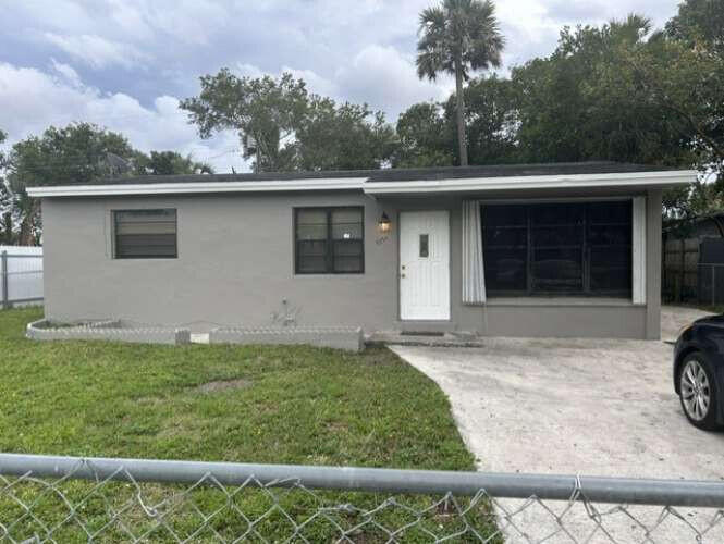 Photo of 3370 NW 8th Place, Lauderhill, FL 33311 (MLS # B26044897)