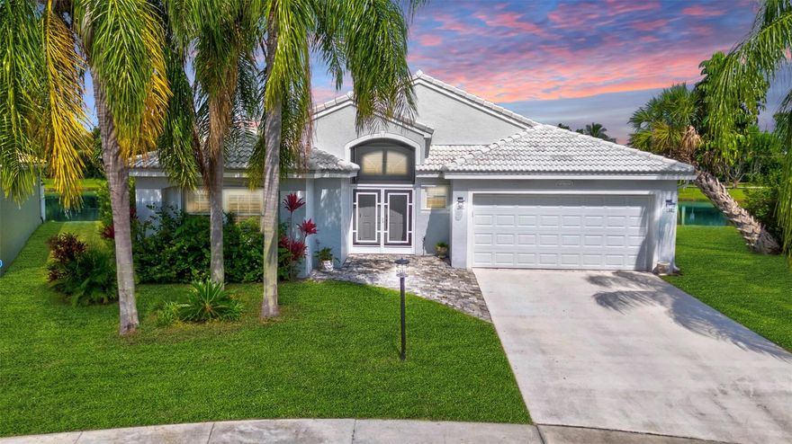 This charming 3/2 single-family home is perfectly situated on a pie-shaped lot, offering serene water views in the desirable Boca Landings community. Step inside to discover high ceilings, an open, functional kitchen, & a split layout for privacy. The spacious primary suite is a true sanctuary, complete with a walk-in closet and a newly renovated, spa-like bathroom. Two additional bedrooms share a stylishly updated guest bath. Enjoy breathtaking sunsets & tranquil lake views from your screened, wraparound patio—the perfect spot to unwind. Boca Landings provides resort-style amenities, including an Olympic-sized pool, tennis, & pickleball courts, all with a low HOA fee that also covers internet and cable. Located within an A-rated school district, this home is your perfect everyday escape.