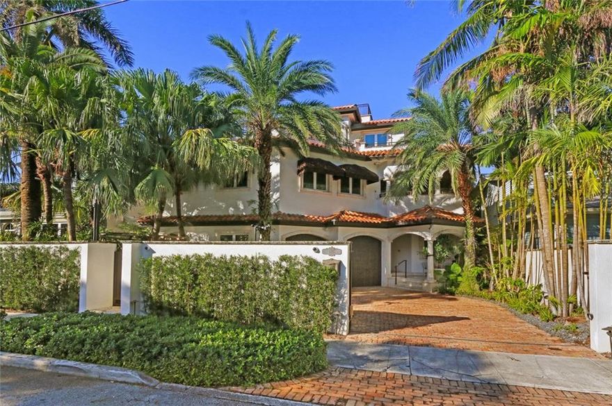 Desirable Idlewyld waterfront residence, only minutes from the inlet by boat, short walk to Las Olas and the ocean. Three story, 6 bedroom, 6.5 bath home with massive ceiling heights, multiple terraces, large balconies and loft area. Two spacious master suites, private terrace, wine tasting room, coffered ceilings, Gourmet Chef's kitchen with gas range, gated courtyard entryway, elevator, impact windows, doors and full house generator. First floor guest bedroom with a separate entrance and full bath.