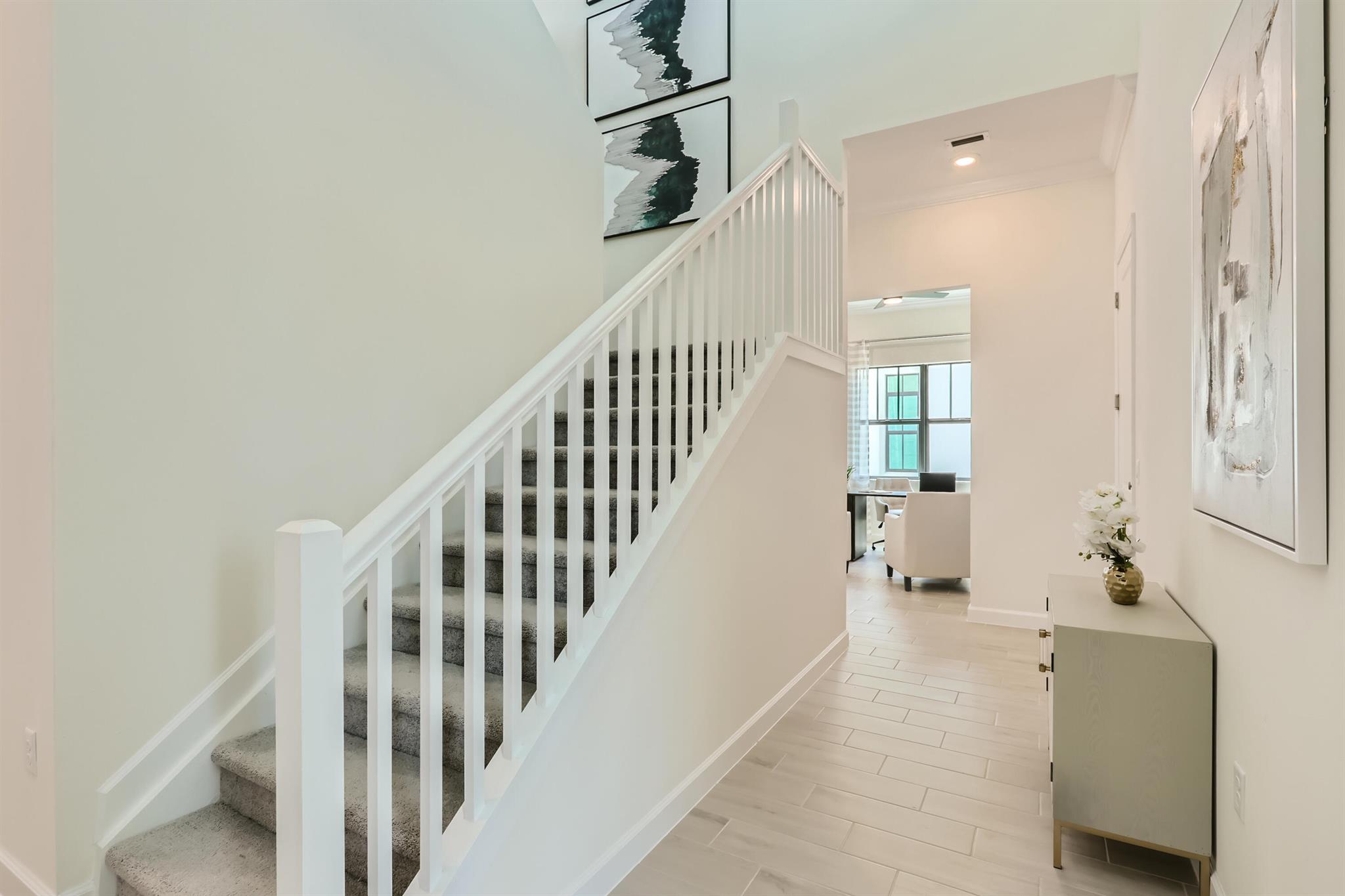 This two-story home combines modern comfort with style. To the side of the foyer is a flex space well-suited as an office, while down the hallway is a cohesive open layout with a covered terrace to deliver seamless living and entertaining. The tranquil owner's suite with en-suite bathroom is tucked into the back corner on the first floor, affording homeowners privacy away from the remaining upstairs bedrooms. The top level hosts a large loft that can function as another gathering area and three bedrooms.Prices, dimensions and features may vary and are subject to change. Photos are for illustrative purposes only.