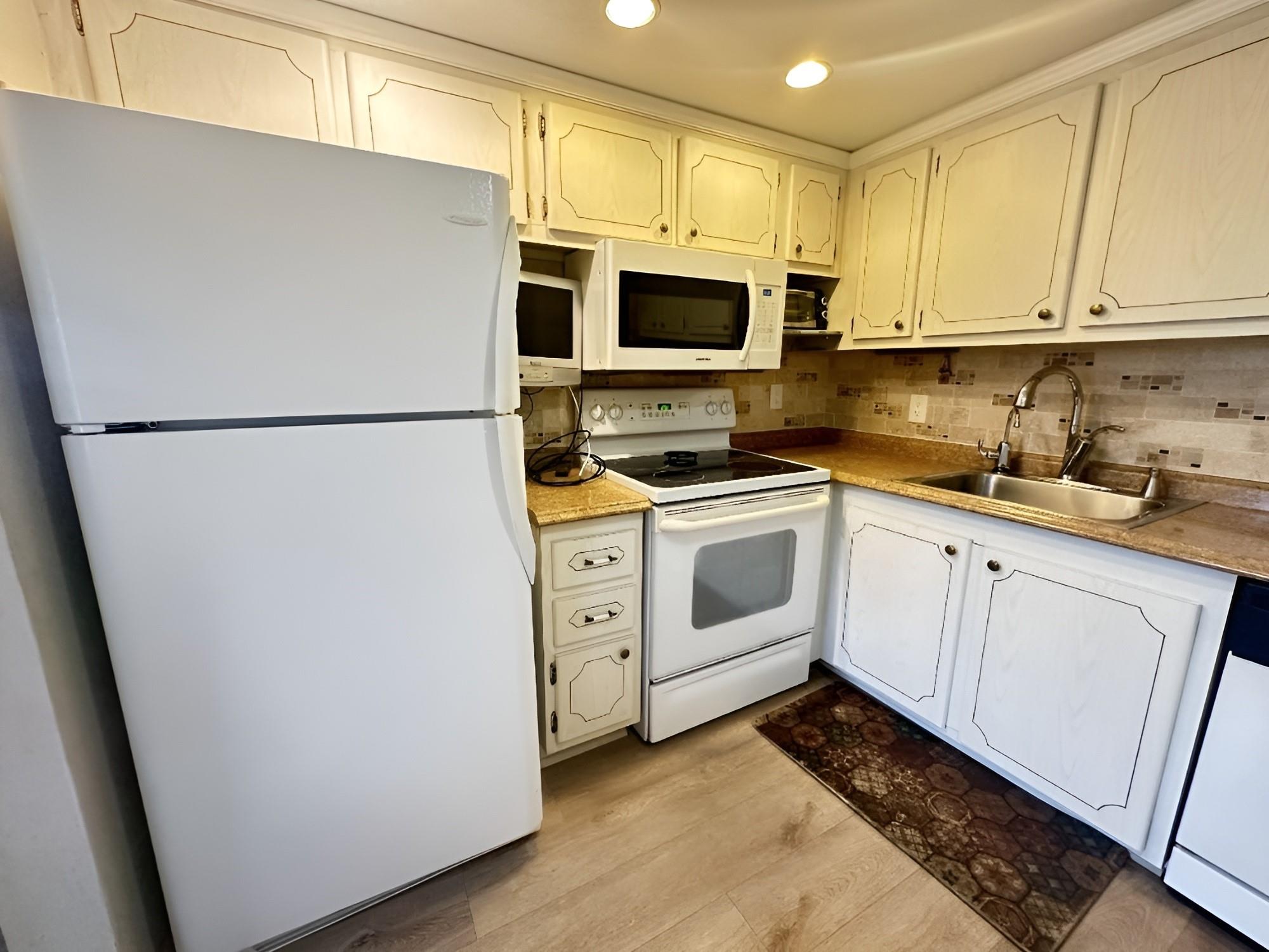 AMAZING DEAL - PRICED TO SELL! Enjoy a serene view from this 2 bed, 2 bath condo! Located in the quiet section of Ellesmere A this lovely condo features an updated kitchen w/white appliances & flood lighting. NO popcorn ceilings in kitchen! Newer A/C 2019. Plantation shutters in liv rm. Ceiling fans in each rm. Furnished, roll down hurricane shutters & extra storage on patio. Extra storage for each unit located by laundry room. Walk to laundry room. Primary bath has granite counter tops, tile on walls. CVE amenities include a lavish clubhouse, 1,500 seat theater w/premier performances, movies, state of the art gym, pickleball & tennis, indoor & outdoor pools, dances, classes of every type & more! Close to beach, shopping, restaurants & major highways. Cash Sale. Assoc. claims 55+
