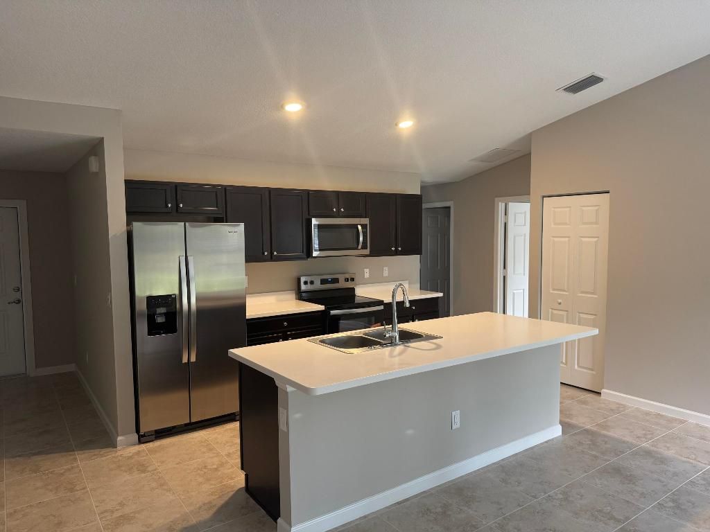 Photo of 1090 SW Estaugh Avenue, Port Saint Lucie, FL 34953 (MLS # R11151739)