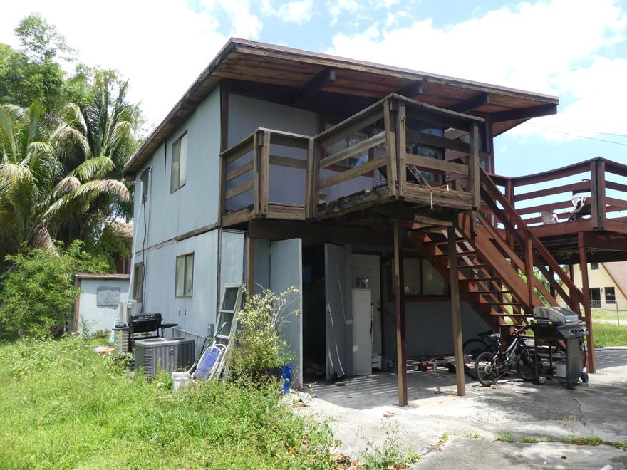 Estate sale opportunity at 6665 Rigger Rd in Lake Worth featuring a unique elevated living design and strong value-add potential. The second floor offers an open kitchen, dining, and living area with exposed beam vaulted ceilings and tongue-and-groove wood decking, creating volume and character. Sliding doors lead to a large wood deck ideal for indoor-outdoor living. The ground floor includes three bedrooms, providing functional separation. Additional features include central A/C and wood flooring. From an investment perspective, the property's interesting aesthetic and architectural bones make it an ideal candidate for a design-driven renovation or flip. The oversized deck, elevated living areas, and vaulted ceilings offer strong lifestyle appeal post-renovation. Property has a lien** Estate Sale Includes:  Folio                                        Address             List Price Sq Ft Adj SF Lot Size Age        Bed Bath SFR 00-43-45-06-02-043-0070  6633 Rigger Rd  $385,000  1388 1224 9351 1978 3/2 SFR 00-43-45-06-02-042-0070  6640 Rigger Rd  $385,000  1856 1502 17860 1981 3/2 SFR 00-43-45-06-02-042-0090 6650 Rigger Rd   $385,000    17856 1981  SFR 00-43-45-06-02-043-0090 6663 Rigger Rd   $385,000  1820 1470 9351 1974 3/1 SFR 00-43-45-06-02-043-0080 6665 Rigger Rd   $385,000  1594 1287 9351 1983 3/1  The property is currently subject to cross-collateralized liens associated with other assets within the estate. Counsel for the Personal Representative is actively coordinating with the relevant jurisdictions to segregate and satisfy these obligations, with the objective of delivering clear and marketable title at closing.