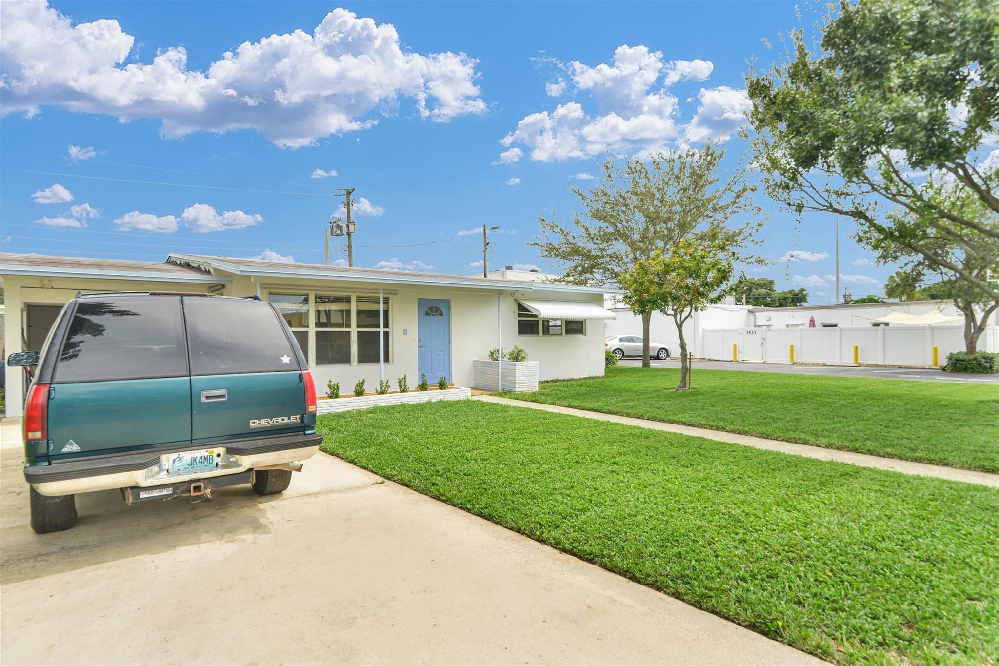 This charming single-family home is ideally located just steps from Atlantic Blvd, offering quick access to Federal Highway, I95, and the beach. Recent upgrades include new faux wood flooring, fresh paint, and ceiling fans in Dining & Living room. The laundry room has a new washer. The split-plan layout includes a master bedroom with an en suite bathroom and walk-in closet. An inviting interior courtyard features a built-in grill. Enjoy the convenience of being close to downtown Pompano's dining and shops. Ample storage, carport, and guest parking available. It's pet-friendly, rent includes water, trash, and lawn maintenance, and there's no HOA. Rapid approval with background check. income verification and 650+ credit score. Contact the agent or use showing time for viewings.