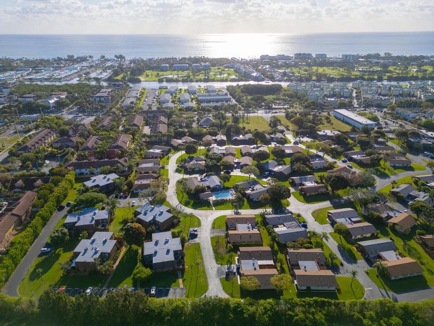 Nestled in the heart of east Boynton Beach and less than 10 minutes from the beach is where you will find the quaint townhouse community of Los Mangos. This spacious 2 bedroom, 2.5 bathroom townhouse offers convenience with its location to the beach, downtown Delray, Bethesda East, shopping and restaurants. Entertain effortlessly in your beautifully updated kitchen featuring granite countertops, stainless steel appliances, and a tile backsplash. Prefer al fresco dining? Take the party outside to your large private fenced-in patio area perfect for friends or family gatherings. Move-in ready with peace of mind thanks to a new roof (2023), A/C (2020), and water heater (2019). Enjoy the convenience of tile/carpet flooring, updated bathrooms, storage shed and storm shutters for added security.