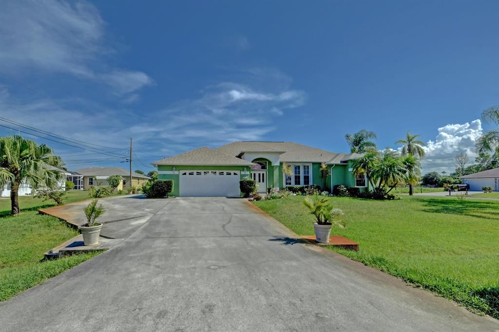 Photo of 5695 NW Delmar Avenue Ave, Port St Lucie, FL 34983 (MLS # R10740077)