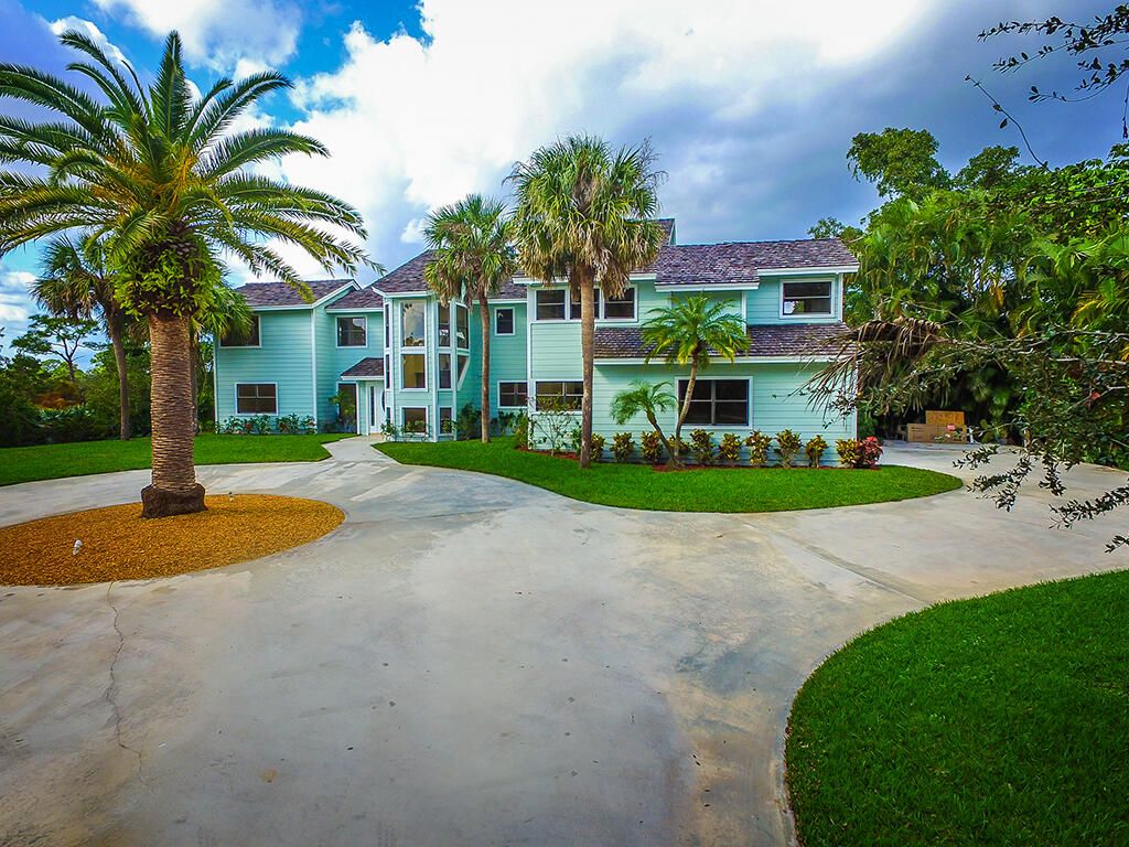 Photo of 3820 NE Kestral Drive, Jensen Beach, FL 34957 (MLS # R10866620)