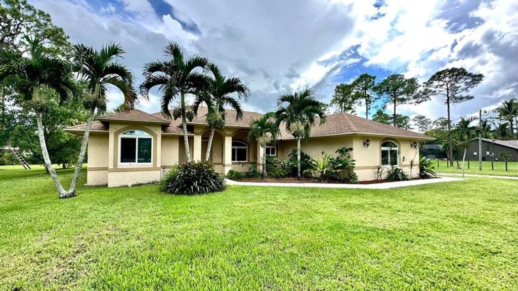 Photo of 15520 Key Lime Boulevard, Loxahatchee, FL 33470 (MLS # R11014014)