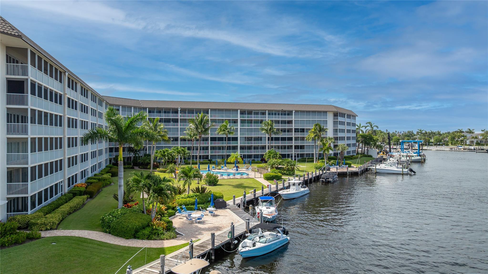 Along the captivating coastal city of Deerfield Beach, you’ll find an area both bustling with activity & tranquility alike. This spacious 2 bedroom 2 bathroom condo residence offers a beautifully positioned waterfront vantage with wide intersecting canals that are so alluring. Kitchen features wood cabinets, granite countertop, SS appl. Impact sliders 2025, tile floors 2025, freshly painted, lovely bathrooms, 2 walk-in closets, AC 2025. Stunning sunsets from your large screened balcony as boats pass by from Marina One Yacht Club winding through prestigious Royal Palm Estates across your waterway view. Enjoy pool, clubhouse, fitness cntr, hotwire TV/Internet incl. Boat dockage when available! Min to Int’l Fishing Pier, beach, restaurants, shopping & local conveniences. 40 yr cert complete.