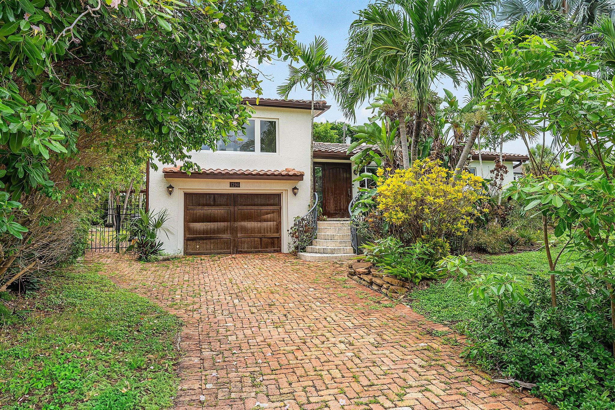 Move right in, renovate or build on this 8800 square foot lot in the ever popular Golden Triangle, in East Boca Raton. This 3 BR/2BA pool home is a short walk to Lake Wyman Park, with its walking trails, sports fields, and kayak/canoe launch, as well as Mizner Park, downtown Boca and the Beach!The kitchen with an island is open to the living areas, and a fireplace divides the den, to create a separate office space.The primary bedroom is located on the main floor, and two additional bedrooms and a bathroom are upstairs. Enjoy an outside oasis with fully fenced in backyard, and charming gathering spaces next to the private pool. The home has complete hurricane protection with impact windows, newer pool surface and washer/dryer.With its charming Spanish design and inviting character