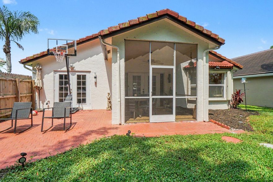 Located in the gated West Delray Beach community of Newport Cove, 7786 Stirling Bridge Blvd S offers comfortable single-family living in a well-maintained neighborhood known for palm-lined streets, lakes, mature landscaping, and a quiet residential feel. This 3-bedroom, 2-bath home with a 2-car garage sits on an oversized lot and features a split-bedroom layout, granite kitchen, stainless steel appliances, tile flooring, plantation shutters, and open/screened patio space. Newport Cove offers desirable community amenities including a clubhouse, pool, tennis, basketball, fitness room, playground, and walking paths, with convenient access to nearby shopping, dining, parks, Atlantic Avenue, and Delray Beach attractions.
