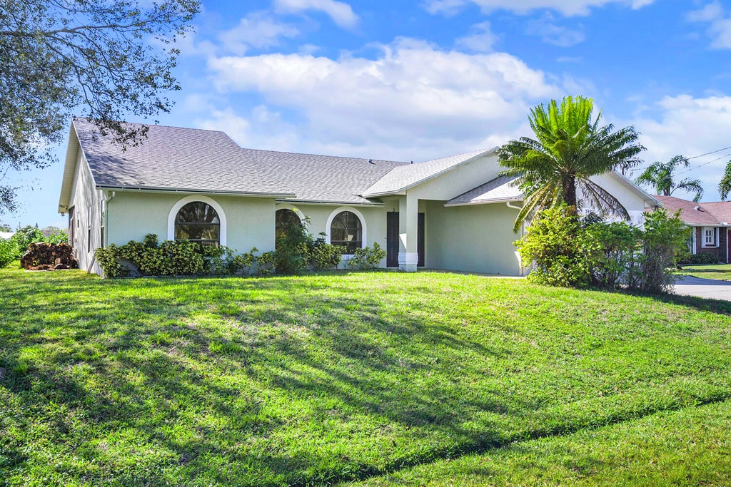 Photo of 398 SW Carter Avenue, Port Saint Lucie, FL 34983 (MLS # R10960343)
