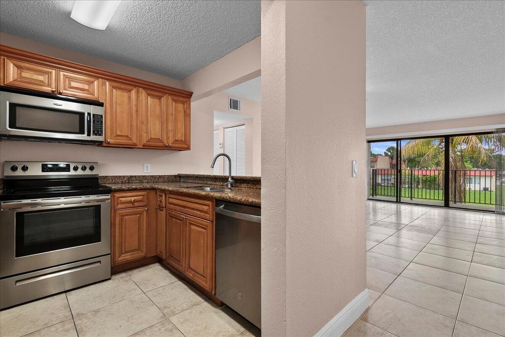 Photo of 1524 Lake Crystal Drive #F, Royal Palm Beach, FL 33411 (MLS # B26037100)