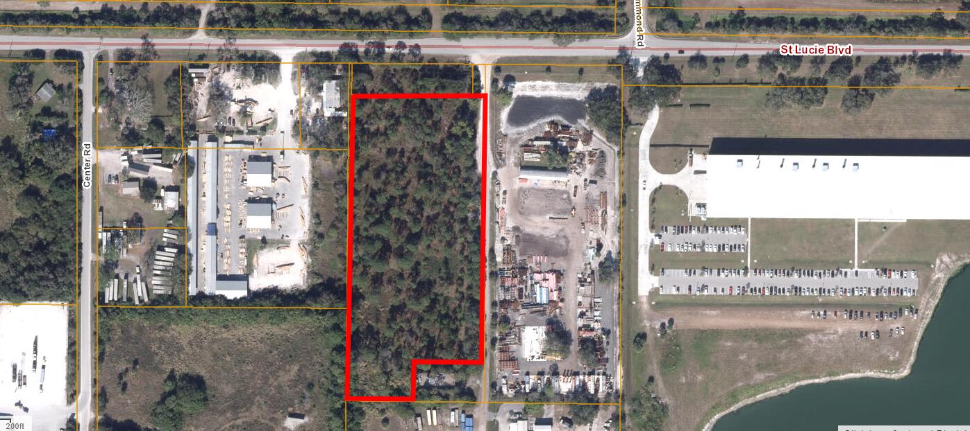RARE FIND! Approximately 5.5 acres zoned light industrial. Only 500 feet from the SE corner of the St. Lucie International Airport. Rapidly growing area. The property fronts St. Lucie Blvd and has 756 feet of frontage on a non-exclusive easement road on the East side of the property(the East 30 ' of the property is part of the 60 foot road easement). HIGH AND DRY.The back 90 x 180(+/-)with cell tower does not convey with this sale. Final acreage to be determined by survey.Also includes small narrow strip of property on West side of subject property approximately 4 feet x 836 feet(.09 acre per tax assessor) PID- 1431-211-0001-0208