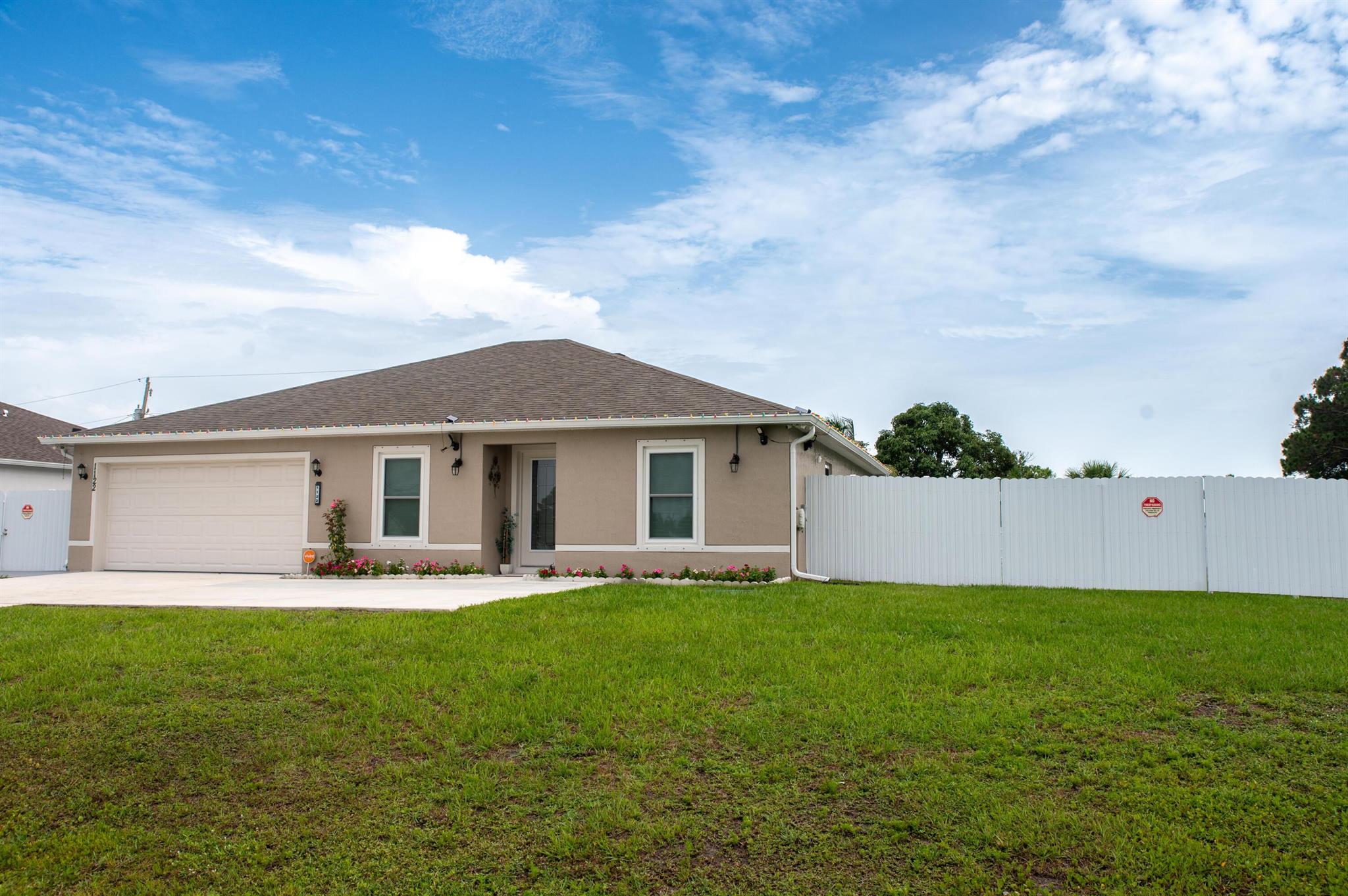 Florida at it's best! This move-in-ready Foxtail model features 3bedrooms,2 baths, impact glass (2024) and an open concept kitchen with white cabinets and granite counter tops(2023).Enjoy new wood laminate flooring(2023)Custom lighting and a split layout with a private owners suite with custom walk-in-closet. The laundry room offers direct access to the 2 car garage. Outside is an entertainers dream with huge concrete patio(2024),covered lanai,6-ft metal fence, solar lighting and upgraded exterior lights. The work is done just move in and enjoy!