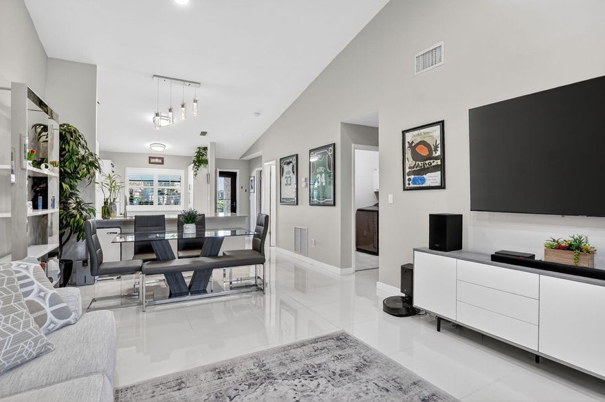 Welcome to Boca Glades, a gated, all-ages community ideally located in the heart of Boca Raton, just minutes to the Turnpike, I-95 top-rated Boca schools, dining, shopping, and beaches.This spacious 2-bedroom, 2-bath lakefront villa offers 1,317 square feet under air and a bright, open layout designed for both comfort and functionality. Enjoy tranquil lake views from your enclosed A/C patio.The kitchen features granite countertops and flows seamlessly into the main living areas, while thoughtful upgrades throughout the home include hurricane impact windows and shutters, electric blinds, blackout blinds in the bedrooms, built-in closets, a brand-new water heater, and a brand-new