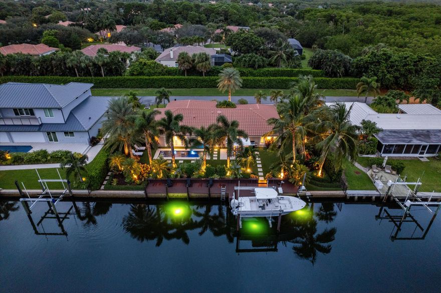 🌴 Luxuriously Renovated Waterfront Pool Home in The Soundings, Hobe Sound, FL 🌴 Discover coastal living at its finest in this impeccably renovated 3-bedroom, 2-bath pool home with a 2-car garage, located in the highly sought-after Soundings neighborhood of Hobe Sound. This waterfront gem offers 110 feet of frontage and is a boater's paradise, featuring two boat lifts (24K)with electric and water hookups—all with no fixed bridges to the Intracoastal and ocean. 🏡 Interior Highlights: Gourmet kitchen with Cristallo quartzite countertops, top-of-the-line Wolf & Sub-Zero appliances, including a 48-inch 8-burner dual-fuel Wolf range (under warranty)Open-concept living space with 2x5 Limestone tile throughout, Fully furnished with a few exclusions—move in Lutron smart lighting system for modern convenience, Fresh paint inside and out for a like-new feel, African mahogany hurricane-rated double front doors, PGT impact glass windows throughout, New roof (2015) and 21 SEER A/C (2018) with all-new ductwork.
Outdoor Oasis:
Gas-heated pool with color-changing lights and a stunning water feature, Coquina stone pool deck and artificial turf for low-maintenance enjoyment, Lush tropical landscaping with exotic palms and landscape lighting, Epoxy-coated garage floors for durability and style. This home blends high-end finishes with relaxed Florida charm. Whether you're an avid boater, entertainer, or simply seeking a serene escape, this property checks all the boxes.
The Soundings offers a private marina, clubhouse, tennis courts, and moreall minutes from pristine beaches, shops, and dining.
Schedule your private showing today to experience this exceptional waterfront lifestyle. Don't miss outthis opportunity won't last!