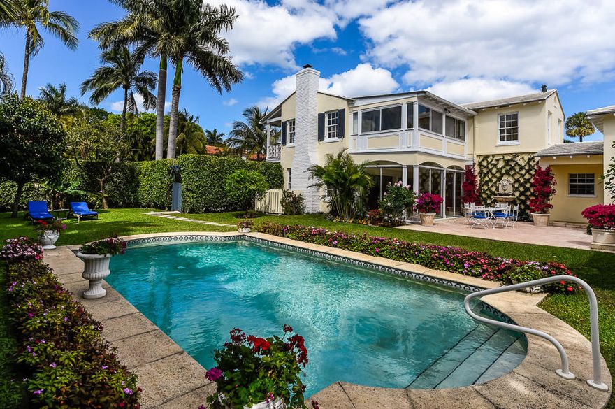 Perfect in-town location!  Built on a double lot on one of the “Sea” streets, this lovingly maintained Monterey/Colonial home was designed by notable society architect Maurice Fatio and built by E.B. Walton.  The 3,845 sq. ft. house offers a first floor master suite plus three guest bedrooms, renovated kitchen, guest baths and powder room, new tile floors, refinished wood floors and new carpeting throughout.  Gracious room proportions and high ceilings.  The loggia overlooks the expansive terrace and large gardens which include a 30’ pool.  Separate garage apartment with two bedrooms and one bath plus air conditioned garage.