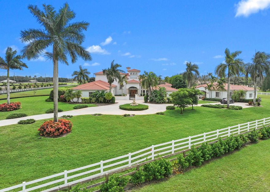 Stunning estate home with guest house situated on 6.68 acres, one of Palm Beach Point's largest lots & hackable to the WEF Showgrounds expansion. This meticulously maintained property provides the perfect canvas to style the residence your way and custom build the equestrian amenities. The main residence boasts 4Br's plus an office, 14' ceilings, home-theater, personal gym and loft area. The Kitchen features a center-island, gas cooking & double ovens. The home has beautiful natural light, mahogany wood floors, an expansive pool & patio w/built-in BBQ area, gated entry drive & 4 car garage. The private detached 2Br guesthouse features a den & screened patio, perfect for staff or the in-laws. Don't miss out on this great opportunity to be on an oversized lot in a prime location!