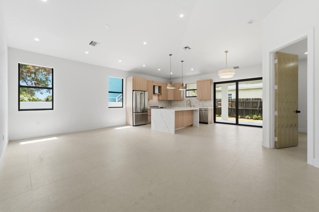 Photo of 710 Talladega Street, West Palm Beach, FL 33405 (MLS # B26043343)