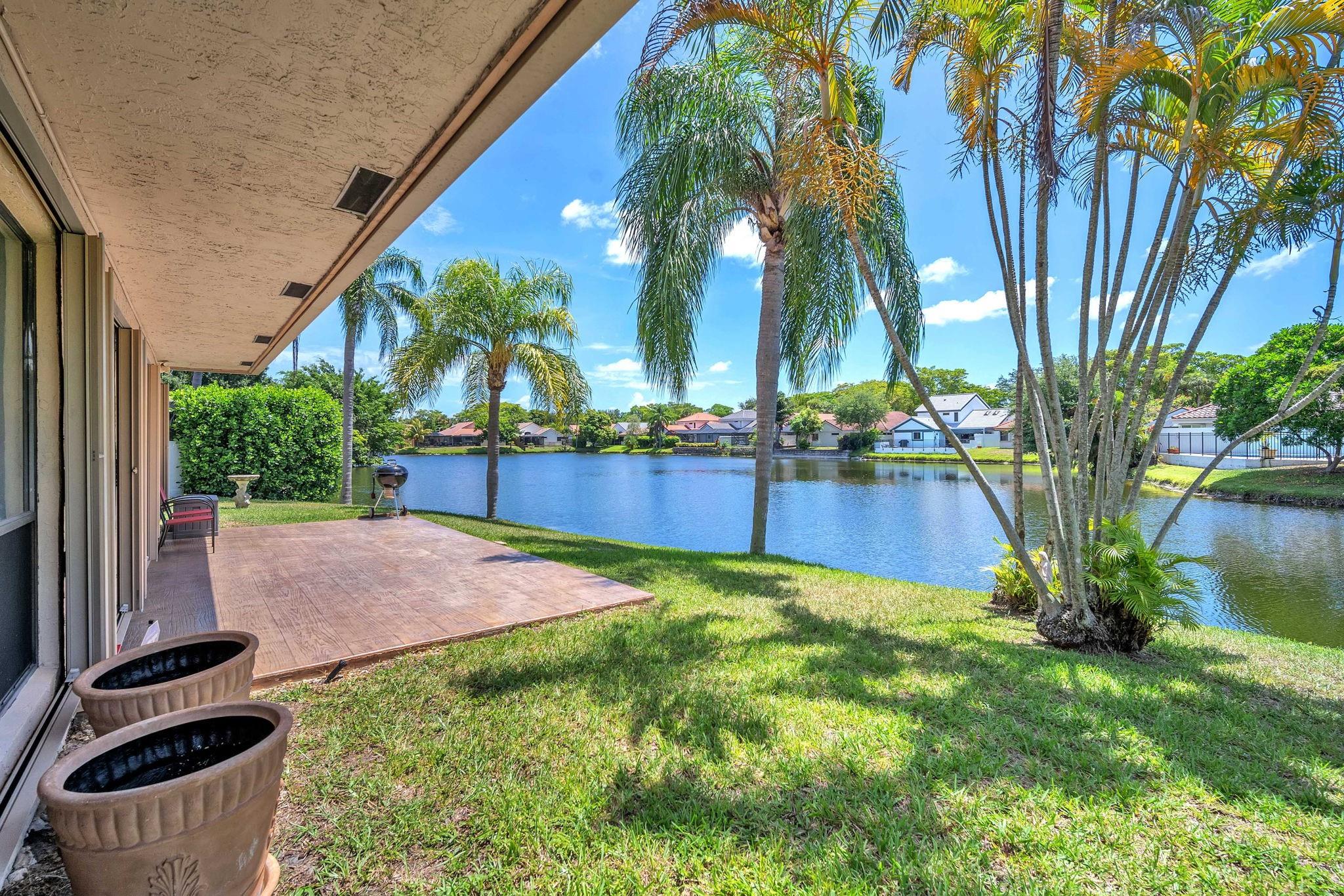 Lakefront culdesac 4/3 home with beautiful relaxing views on a pie shaped lot. This is a very well cared for home w/polished Mexican Saltillo tile on first floor, open layout, game room has a pool table perfect for entertaining. Kitchen has newer appliances, cabinets, and granite countertops. A full bedroom and bath on the first floor/guest suite or office area. 3 bedrooms and 2 baths upstairs w/spacious rooms and walk in closets. Extra large stamped concrete patio perfect for sitting and enjoying the lovely water views. Larger lot with side yard w/room for a pool. Exterior features Gutters, Impact garage and front door, impact windows upstairs and accordians shutters down stairs. Convenient to major expressways, restaurants and shopping centers that Plantation offers. Hurry to view!