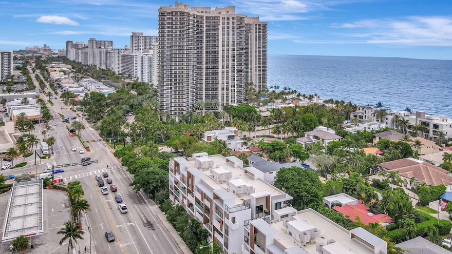Direct ocean view from your living room, kitchen & balcony.  bright, spacious unit. NE corner. Updated kitchen. Tiled throughout the unit. Impact windows/doors. Move in condition. Watch the pool and beautiful 2nd deck. View of  galt ocean all the way north to lighthouse. Walk to the beach, shops, many popular restaurants, Publix across the street. Garage pkg. 24hr front desk svc. guest pkg outside. Glass balcony. 2025 roof. 50yr milestone done, water cooler.  Hoa includes, water, sewer, trash pick up, basic cable, high speed fiber optic internet, pest control. You only pay electric. Extra storage &  Laundry facility on same floor. Bike storage in the garage. Great place to live. great location to be in.  Bayview school boundary. A rated elementary. all ages. Easy to show. NON smoking bldg.