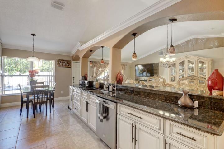 Beautiful 4 Bed and 3 Bath and 2 car home with a grad entrance and a spectacular backyard with build in grills and tables, granite counter tops and renovated bathrooms.