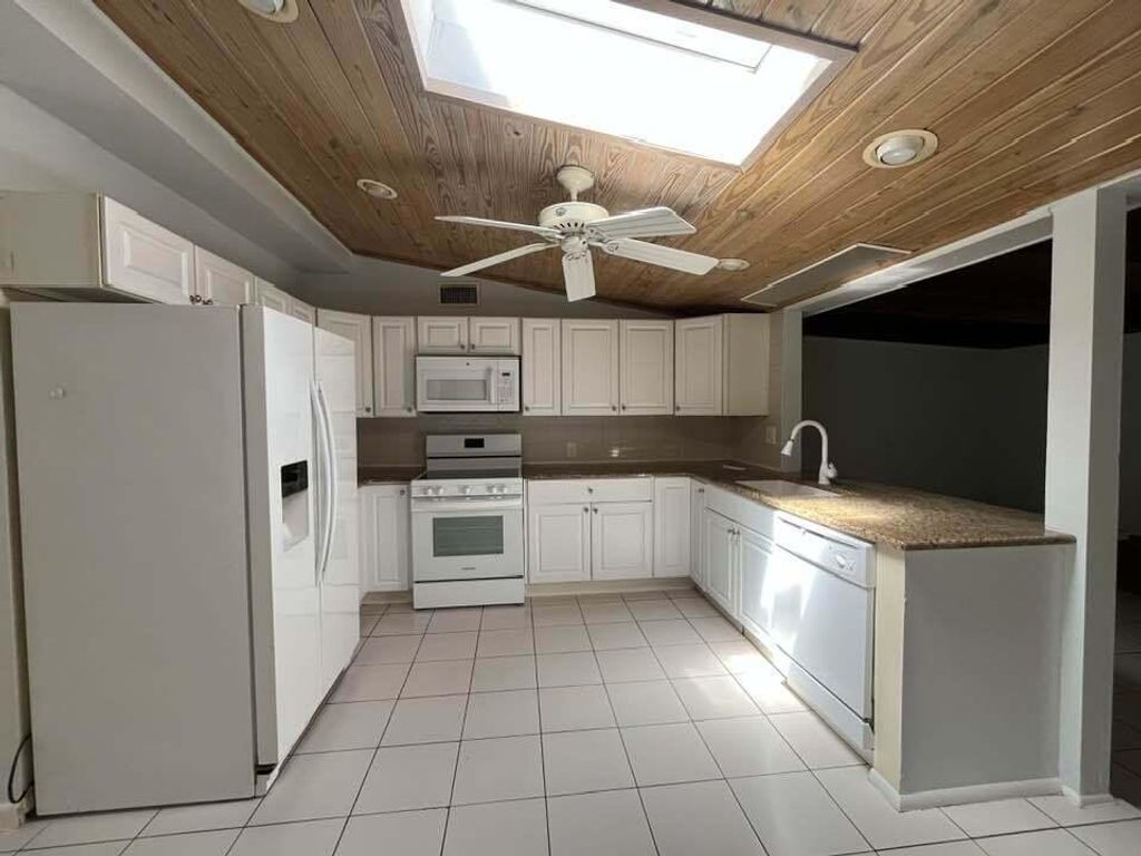 Photo of 1405 NE Waveland Avenue, Jensen Beach, FL 34957 (MLS # R11082361)