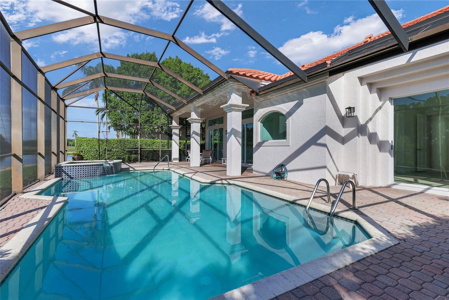 Sellers are very negotiable and ready to make a deal! This spacious single-story waterfront home in prestigious guard-gated Weston Hills offers a screened-in pool and spa, serene canal views, and no rear neighbors for total privacy. Impeccably maintained and move-in ready, the home has not been updated but is in perfect condition—making it the perfect blank canvas to personalize or enjoy as is. Soaring ceilings, walk-in closets, and custom built-ins add timeless appeal, while the community provides lush landscaping, walking paths, and patrolled security 24/7.