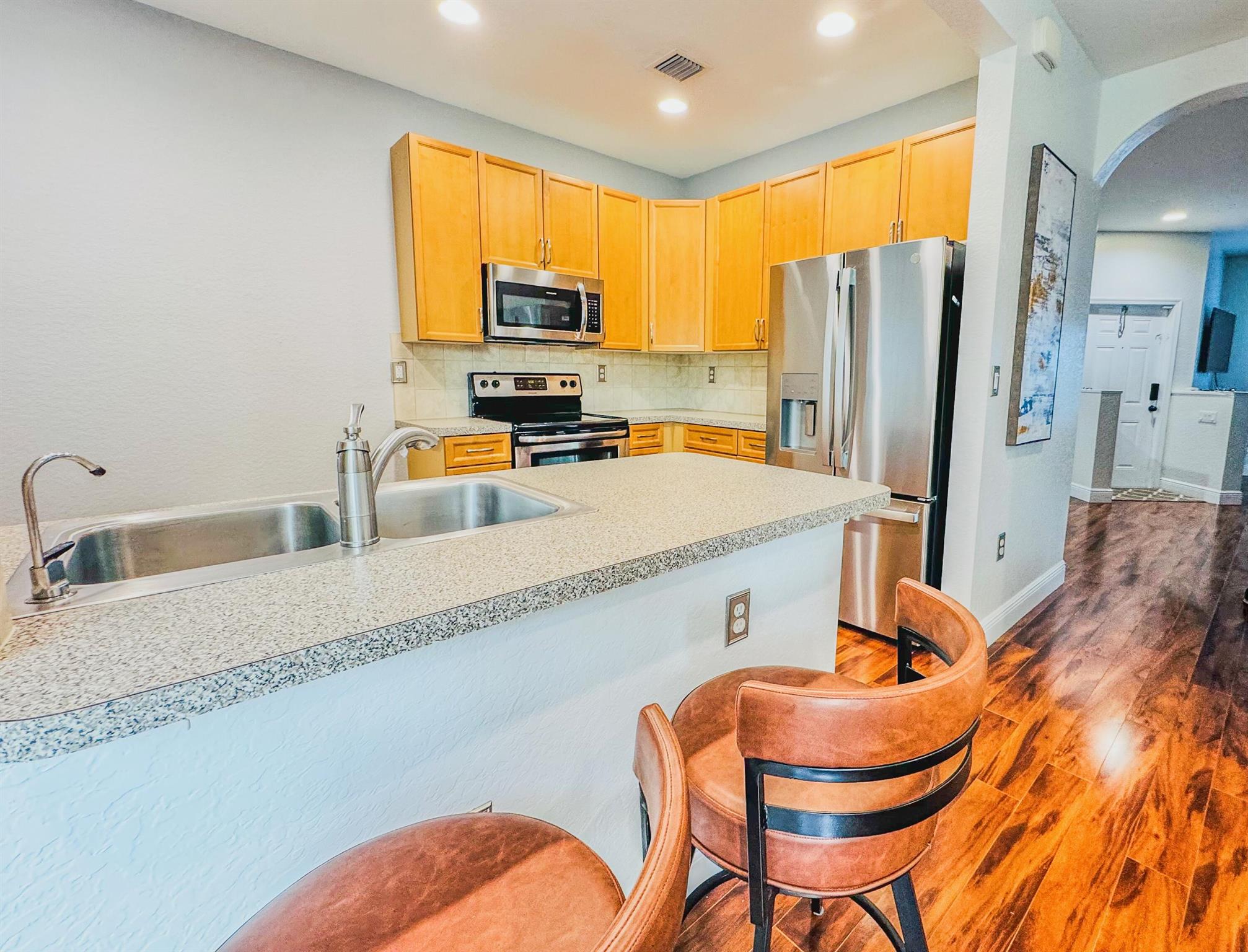 Beautiful two-story townhome available in a safe, gated community just minutes from downtown Delray and major highways. The first floor offers a spacious living room and an impeccable kitchen with modern finishes, perfect for entertaining family and friends. Upstairs you'll find two large bedrooms, each with its own bathroom, plus a convenient laundry room for added ease. The unit comes fully furnished for immediate move-in, but furniture can be removed upon request. Residents enjoy the peace of mind of a gated entry along with the convenience of being close to shopping, dining, the beach, and everyday essentials. Comfort, style, and location all in one!