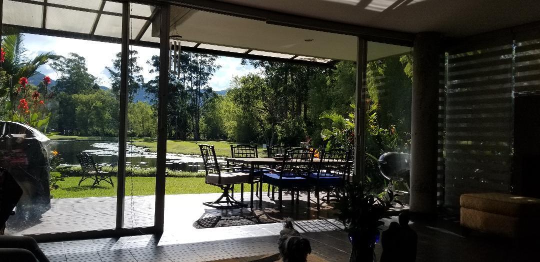 This stunning country house in Llanogrande,Rionegro, Colombia, is an ideal choice for those seeking a serene environment with a breathtaking view. The approx 4,600 SF house on approx 6000 SF is designed in a U-shape with the social area on one side and the private area on the other side. The social area features an open kitchen with appliances, pantry, spacious dining &living room .Beautiful lake views and near great shopping and wonderful restaurants.