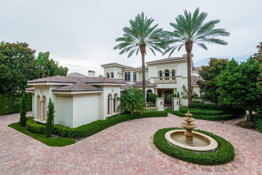 Unbelievably detailed to the finest degree. This six bedroom, 7 full and 2 half bath custom residence was built by a prominent local builder. From the custom glass wood and iron 9 foot high radius entrance door to the vanishing edge pool, dock and long water view less than 850 ft from the intracoastal, every feature is unmatched. Formal living room with coffered ceiling and cast stone fireplace overlooking pool deck and waterway. Formal dining room features Jerusalem gold marble flooring and a magnificent wine room with custom designed built-in wine racks and cooler. The family room has a full bar with cooler, icemaker, sink and granite top and views & opens to patios, pool deck and waterway. State-of-the-art kitchen includes wood cabinetry,