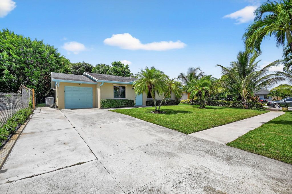 Photo of 1286 W Frangipani Circle, Lake Worth, FL 33462 (MLS # R11111161)