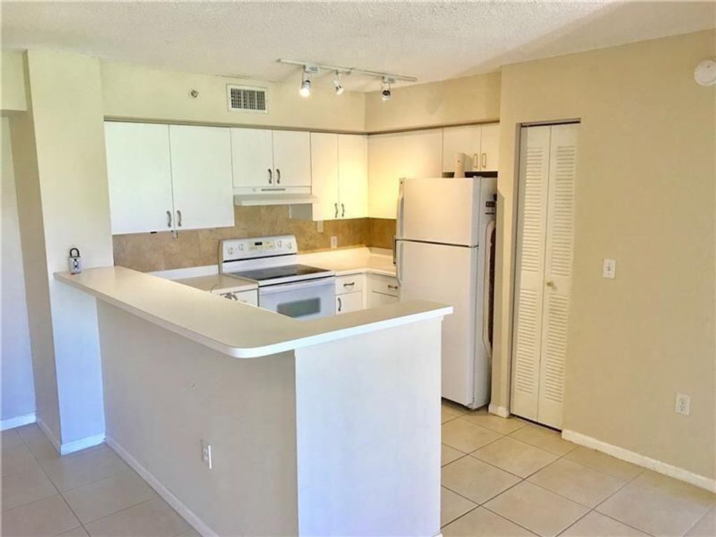 Photo of 7864 Sonoma Springs Circle #104, Lake Worth, FL 33463 (MLS # B26029202)