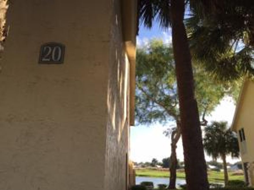 Ground floor unit with screened patio backing up to canal.IT has a stackable washer/dryer about a year old. Carpet is about a year old.Community has a large pool with Bar B Que area,tennis courts.Village Commons plaza is across the street with Publix Supermarket and restautrants.Close to City Place downtown,west Palm international airport.The new outlet mall is minutes away.