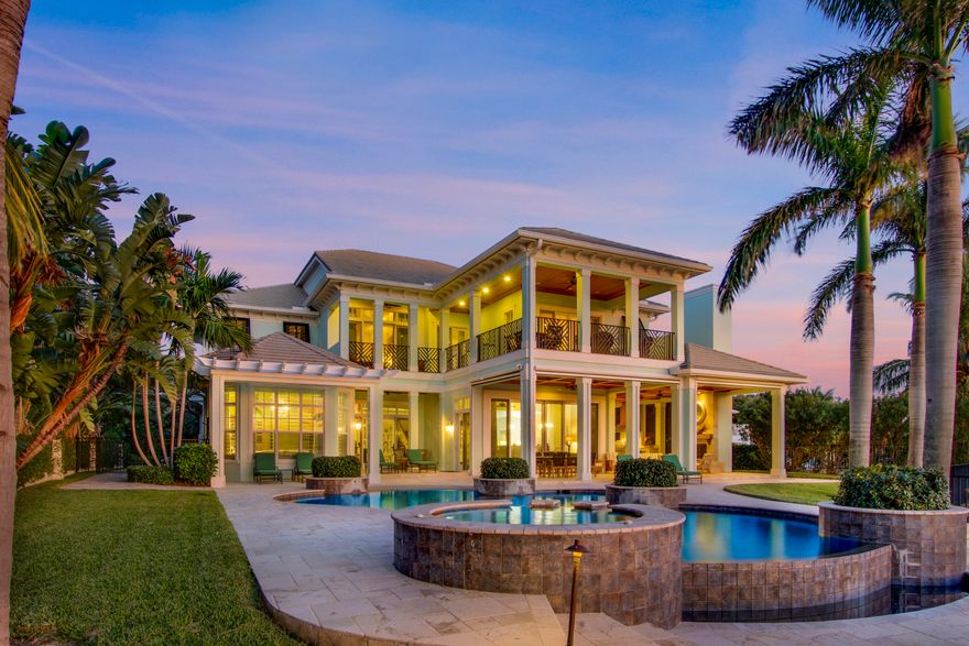 Deeded beach to river!  1.37 acres, 300'+ dock with 40,000 and 24,000 boat lifts, resin dock, etc.  2008 CBS construction, concrete/impact, brand new whole house generator.   7000+ AC living area, furnished, 6  bedroom, 6,5 bath, includes guest studio over garage.   Beautiful vistas and covered patio areas across the back of the residence and add'l balconies in front for cross ventilation and true south florida/tropical living.  Architectural appointments, open trusses, coffered ceilings, a visual masterpiece with glass impact sliders across the back for breathtaking water views and sunsets. Outdoor kitchen, fireplace, beach slope pool, with whirlpool, entirely fenced, gated with fish motif.  There's nothing like this one!