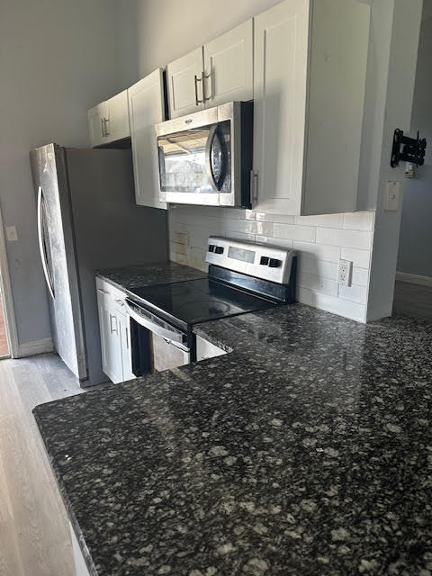 Photo of 413 SE Strait Avenue, Port Saint Lucie, FL 34983 (MLS # R10962870)