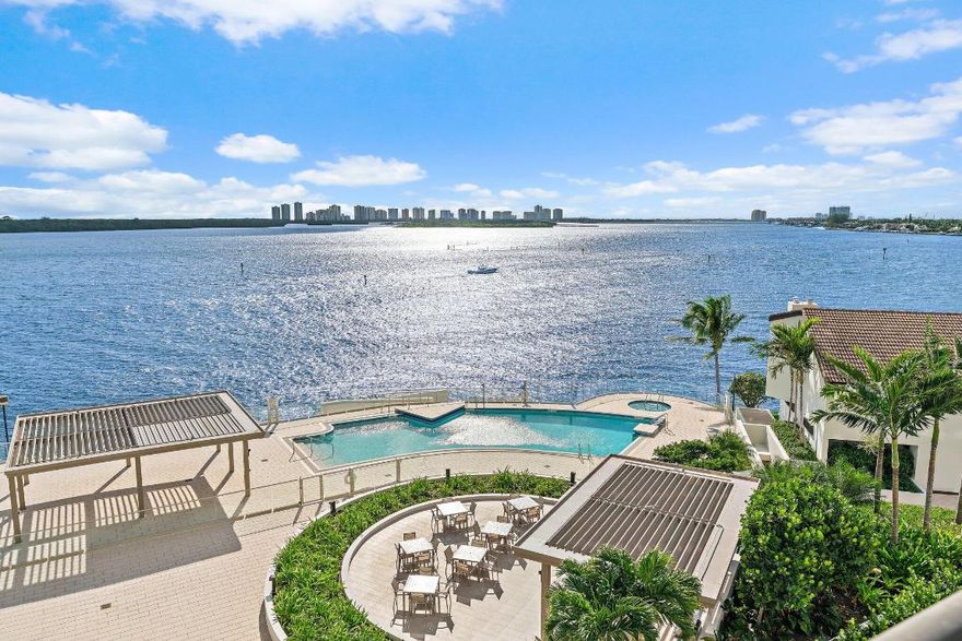 Lake Point Tower's new luxury pool, spa and deck is open and ready for immediate enjoyment! This spacious 2-bedroom, 2.5 bathroom residence in North Palm Beach features sensational wide south intracoastal views, providing an unparalleled waterfront living experience. With over 2600 square feet, this residence allows you to spread out and enjoy breathtaking water views from every room. The living room is generously sized, offering ample space for a grand piano, and included a built in area with wet bar and beverage refrigerator.  Enjoy your meals looking out onto the ocean from both the dining room and eat in kitchen area. New impact glass slider in kitchen dining area was recently installed! Huge walk in customized closets in both bedrooms. Large wrap around balcony with loads of space for outdoor furniture! Newer Bosch Air Conditioner, 2021.You'll be among the first to enjoy the exceptionally designed luxury heated pool and expansive outdoor deck, now complete! Pet friendly building (one small dog allowed). This secure gated waterfront community ensures your safety with 24-hour concierge service and roving security. The underground parking garage provides one assigned space and a private storage area - perfect for bicycles and sports equipment. Amenities abound including a newly renovated modern gym with top-of-the-line equipment, workshop, community room, library, 2 saunas and of course the magnificent new pool! Whether you prefer a workout, engaging in a hobby, or socializing with fellow residents, Lake Point Tower has something for everyone. Old Port Cove has an on-site restaurant, Belle's, where you can dine-in or have your meal delivered to your door. Take advantage of the 2-mile walking path around the perimeter of the community, offering a scenic route for your daily strolls. Watch the luxury mega yachts pull in and out of Safety Harbor Marina. Situated just a short drive away from the area's top restaurants, The Gardens Mall, beautiful beaches, Palm Beach International airport and world-class golf courses, this stunning waterfront property has it all!