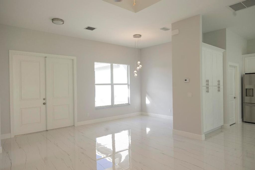 Photo of 6009 NW Wesley Road, Port Saint Lucie, FL 34986 (MLS # R10929909)